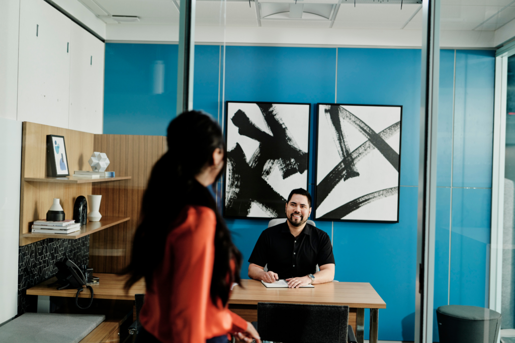 Employee meeting colleague in their office