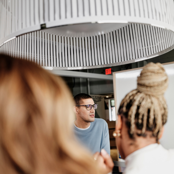 Young colleagues discuss an upcoming project.