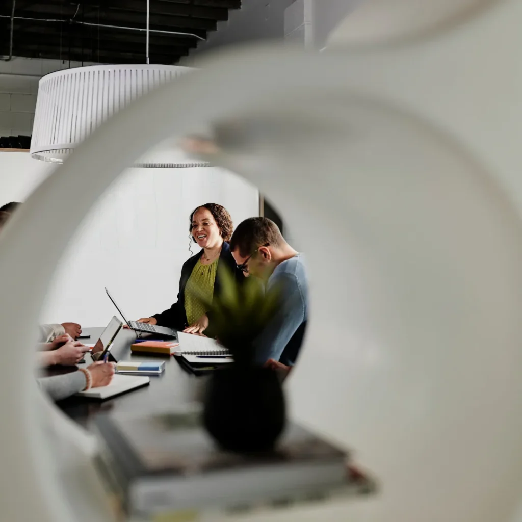 A group of work colleagues connect in a team meeting.