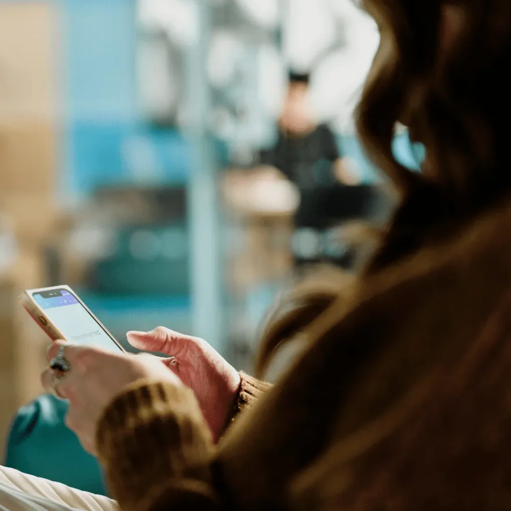 Women is browsing on her cell phone