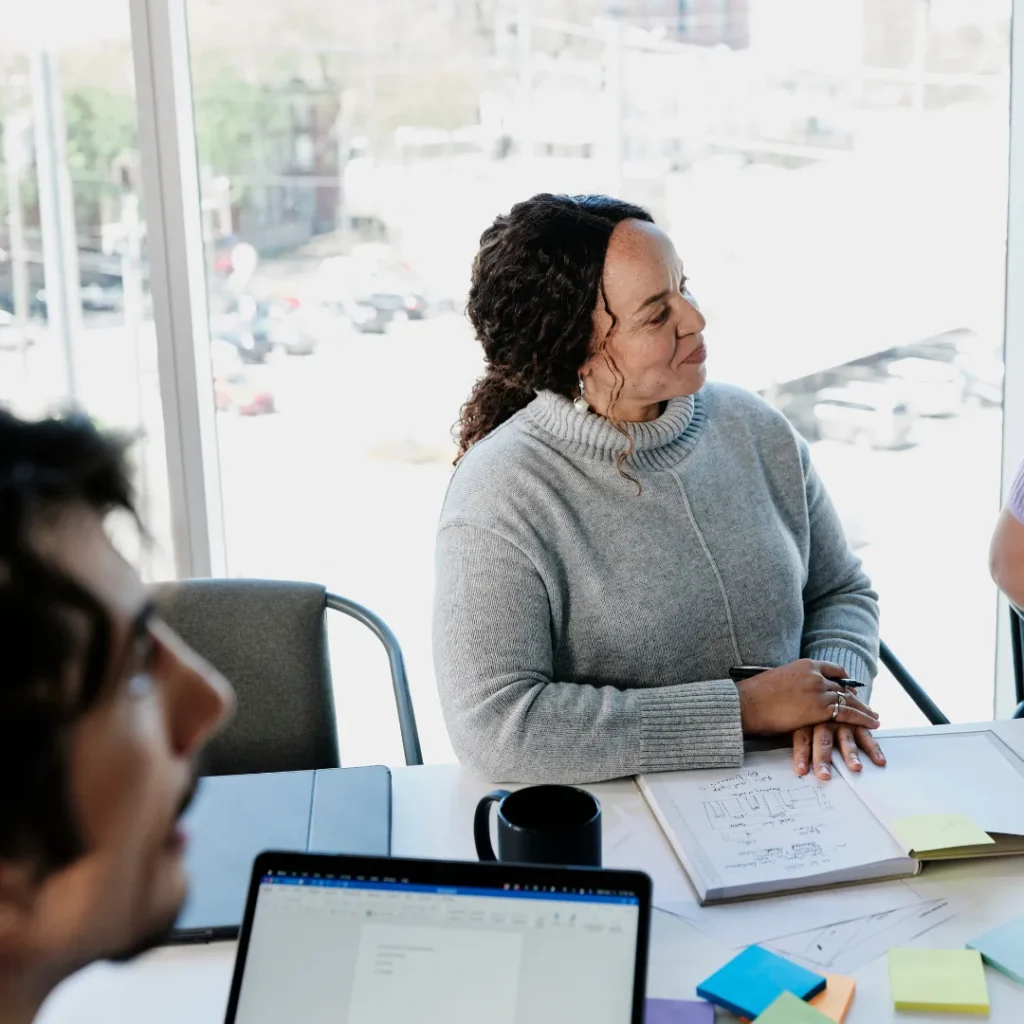 Employee listens to a presentation in a conference room