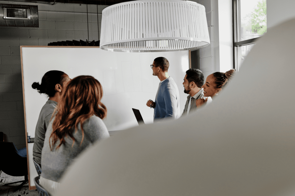 Employee team works out a project in a conference room