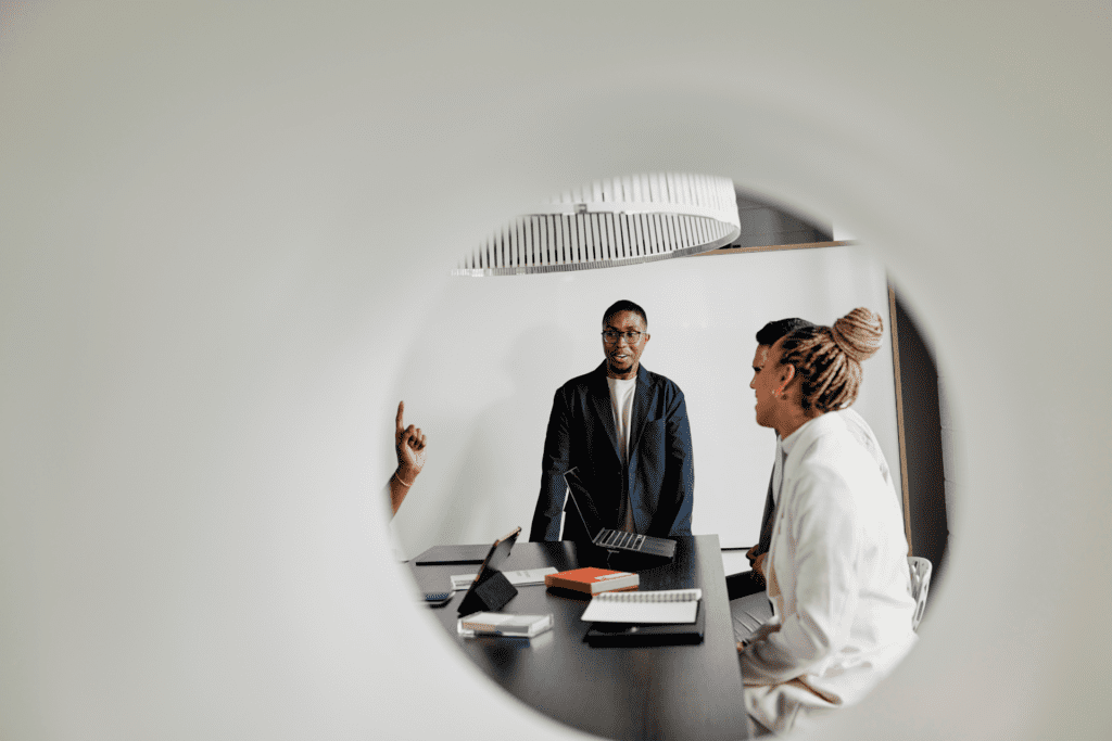 Colleagues talk through a project in a conference room