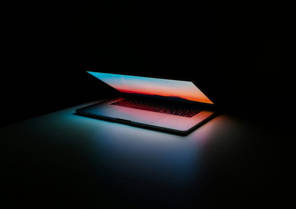 Laptop in the dark, lit up
